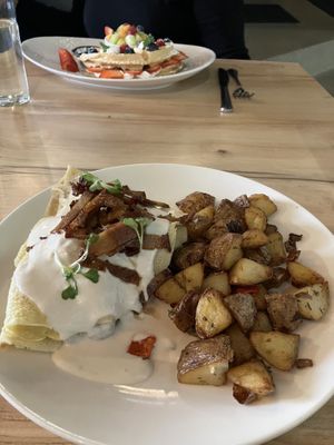 Savory crepe, waffles in the back   at Soli Grill in Evanston