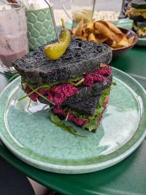 Beetroot, caper and mandarin sandwich with activated charcoal bread at Manga Rosa in Lisbon