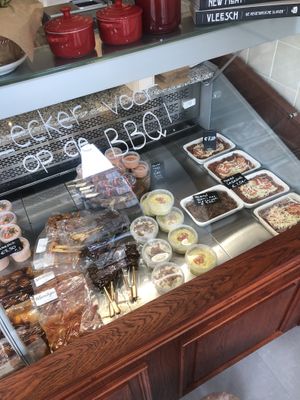 Lasagna, Indonesian fried noodles, a few bread dips and marinated “meat” meant for the BBQ season.  at De Vegetarische Slager Shop in Rotterdam