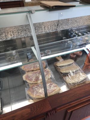 Small no-pepperoni pizza and rendang panini (to-go or eat-in).  at De Vegetarische Slager Shop in Rotterdam