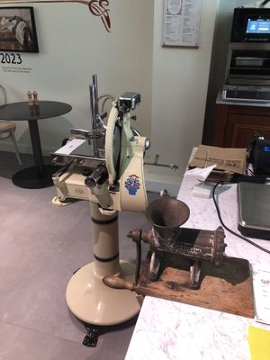 I think this is a vintage meat grinder?🤔  at De Vegetarische Slager Shop in Rotterdam