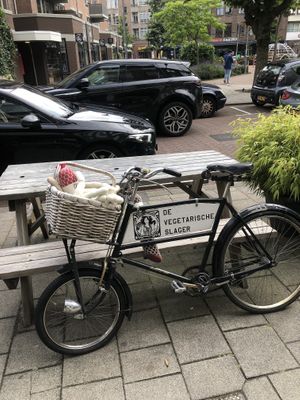 Bike with meat-shaped plushies.  at De Vegetarische Slager Shop in Rotterdam