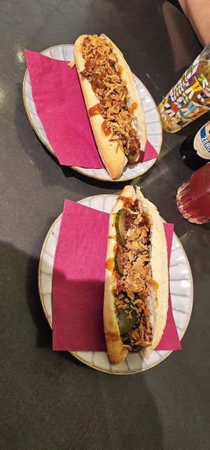 Vegan rendang sandwich en vegan indische bal broodje. Degene met komkommer is de Indische bal. at De Vegetarische Slager Shop in Rotterdam