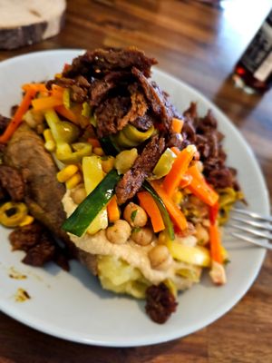 Bakad potatis med seitan och hummus. at Kartoffelkogge in Rostock