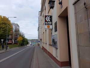 Enterance, Caramba has small yellow logo, below cinema sign (Kino kolory) at Caramba in Gorlice
