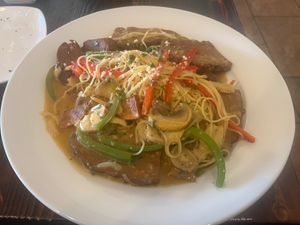 Seitan scarpariello with pasta. It includes sausage, mushrooms, red peppers, banana pepper, and potatoes. at Bella Napoli  in Copiague