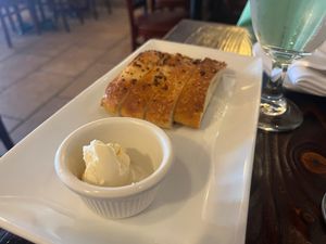 Bread and butter given to guests while they wait for their meal. at Bella Napoli  in Copiague
