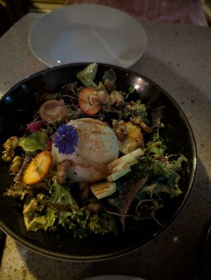 Buratta dish at Les Mauvaises Herbes in Quebec