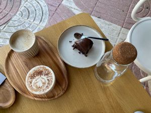Vegan cappuccino and latte, and banana bread (missing a bite) at MUTO in Madrid