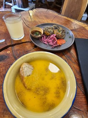 Carrot and ginger soup, lemon and ginger juice, rice paper empanadas with a peanut sauce and pickled veggies at Café Vida in La Paz