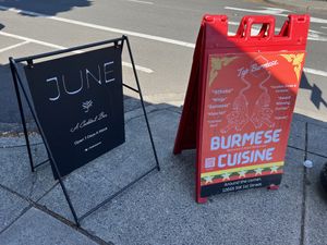 Their signpost and one other for a nearby restaurant  at JUNE in Beaverton