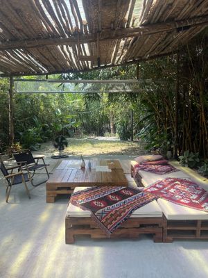 Outdoor seating leading onto the river   at PlantLab in Hoi An