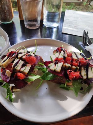 Fermented cheese with beetroot, tomatoes and greens. I would like to have maybe a garlic spread on the bread or some kind of spread as the bread is plain. at PlantLab in Hoi An
