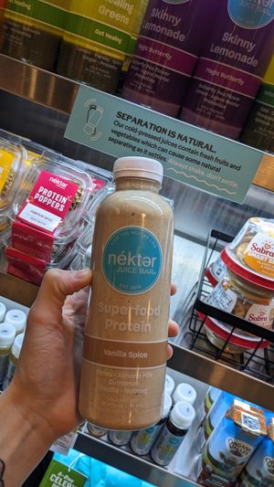 Posted sign on the case to shake your juices kind of cute, always shake don't settle at Nekter Juice Bar in Reno