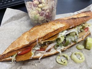Delicious French bread sub sandwich w German potato salad   at Black Market Meats in Lakewood