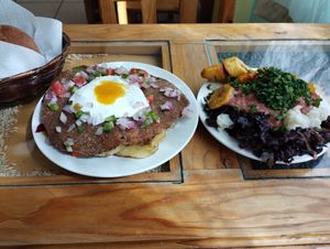 (left) Soy burger with mayo, pumpkin sauce, some salad and rice underneath; (right) the salad. Didn't include the dessert, juice or the soup in the picture lol at Reencuentro con la Naturaleza in La Paz