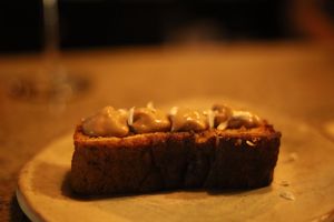 Corn cake with coffee cream at Aliado Bar & Aperitivo in San Juan