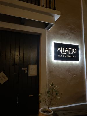 Wasn’t sure until we saw the “We’re open!” Sign 😅  at Aliado Bar & Aperitivo in San Juan