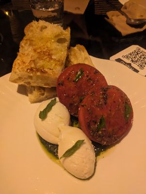 Focaccia with tomatoes and cashew mozzarella at Aliado Bar & Aperitivo in San Juan