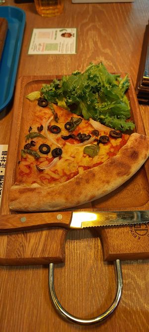 Vegetable pizza slice at Falafel Brothers - Otemachi in Tokyo