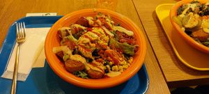 American salad bowl, complete with hard falafel hockey pucks 😞 at Falafel Brothers - Otemachi in Tokyo