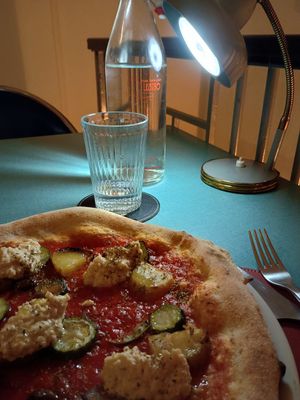 Pizza Semplice (con pomodoro, patate, zucchine, olive, origano, hummus di ceci) at Lestro Pizza Restaurant in Brescia