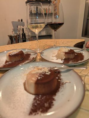 Budinetto al cocco con cacao, mandorle e zucchero a velo. at Lestro Pizza Restaurant in Brescia