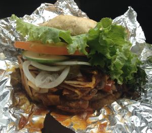 Philly cheeseburger + coconut bacon to go. 10/10  at Luv Burger in Samara