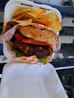Burger with chips and carrot sauce at GuanaVeg in Guanajuato