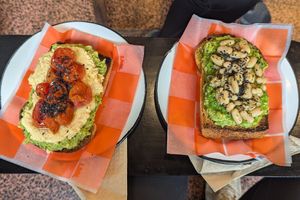 Dos tostones de palta con cubiertas distintas at La Manteca Negra in Buenos Aires