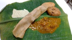 Good curry & coconut sauce w/ a dhosa & donut-like pastry. at Malayan Cafe in Jaffna
