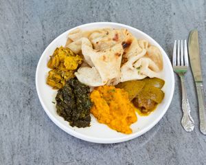 buss up shot roti plate at HAAM - Caribbean Plant Cuisine in Brooklyn