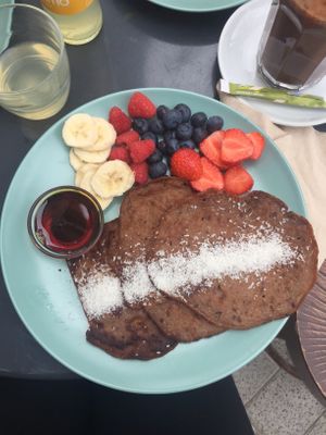 buckwheat pancakes with banana, berrys and maple syrup at Bataat in Amsterdam