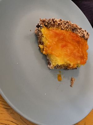 Half eaten tangerine and lemon pie.   at Bataat in Amsterdam