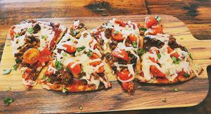 "Meat your heart out" vegan flatbread (made with vegan crustb& vegan mozzarella). at Grain & Berry in Fort Wayne