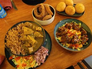 Vegetable Curry with Rice and Peas, Panko Onion Rings, Fried Dumplings and Vegan Jerk Bites at Hummingbird in Newtown