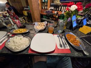Vegan tofu coconut curry (spice level 3), vegan roti, and vegan mushroom masala (spice level 4). So good!  at Spice & Tonic - Indian Cuisine & Bar in Minneapolis