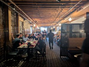 Inside of the restaurant looking back toward the door from the bar area  at Spice & Tonic - Indian Cuisine & Bar in Minneapolis