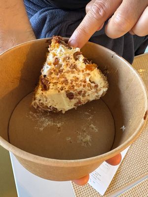 Takeaway “service”: dessert packed upside down, icing ruined, then charged extra.  at Casa Vegetariana in Porto