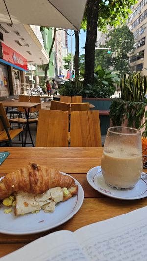 Smoked tofu scramble croissant and oat milk coffee at Teva Deli in Rio De Janeiro