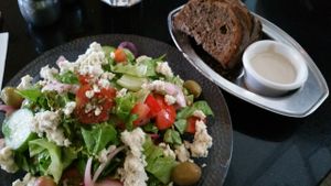 Vegan Greek salad with vegan nut feta cheese and pickled onions at Meshek Barzilay in Tel Aviv