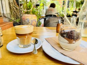 Latte and tiramisu   at Meshek Barzilay in Tel Aviv