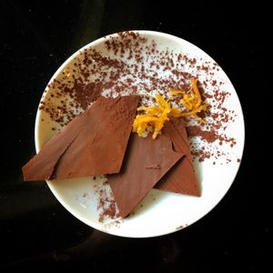 Simple dessert for chocolate lovers, super thin, melt in your mouth chocolate with the tiniest bit of lovely orange peel. at Meshek Barzilay in Tel Aviv