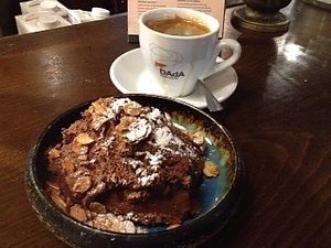 Chocolate mousse with crispy almond flakes 💥 at Meshek Barzilay in Tel Aviv