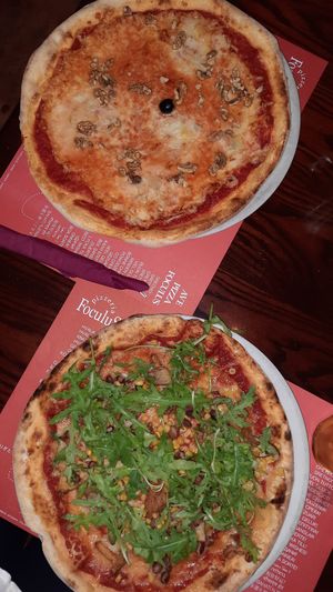 Francescana (left) and magic land with vegan cheese (right). Really big plate. at Pizzeria Foculus in Ljubljana
