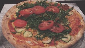 Pizza with vegan cheese at Pizzeria Foculus in Ljubljana