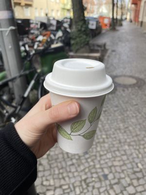 Tiny cup of ‚matcha‘ latte   at Pele-Mele in Berlin