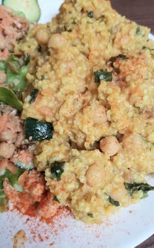 Millet with dates and salad - close-up at Pele-Mele in Berlin