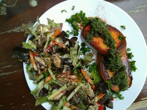 Baked sweet potatoes with pesto and salad at Pele-Mele in Berlin