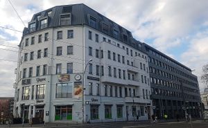 Exterior of location, street view. Entire building: supermarket and cafe on ground floor (1F). Restaurant and shoe store upstairs (2F). at Veganz in Berlin